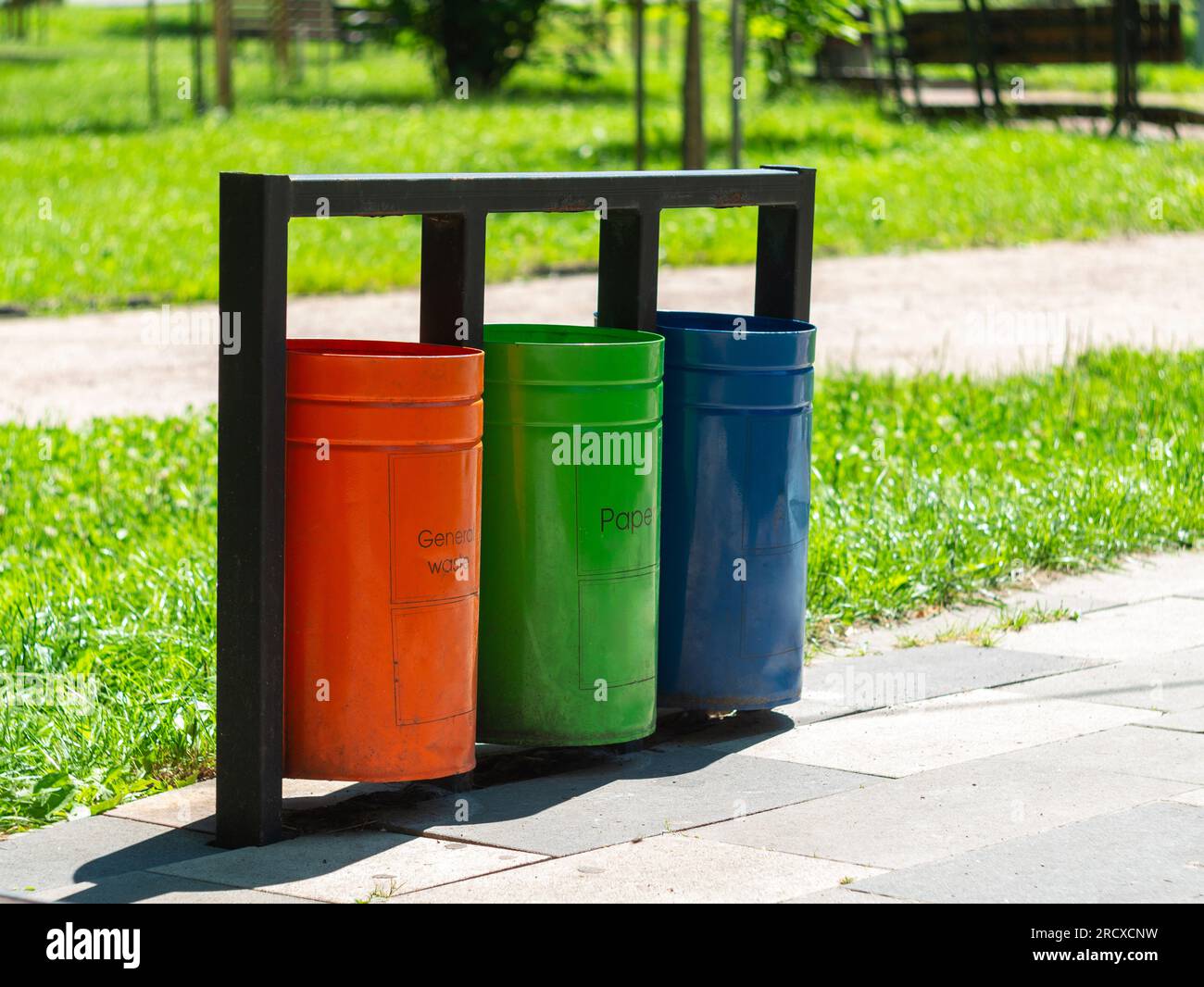 Colorful metal recycle trash bins for paper, glass, plastic, general