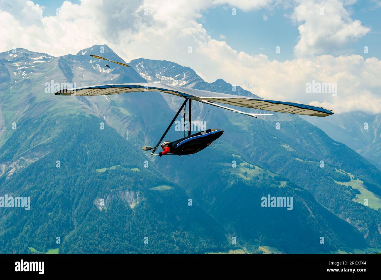 Hang gliders in the Swiss Alps. Modern free flight wings go airborne in Fiesch, Switzerland Stock Photo