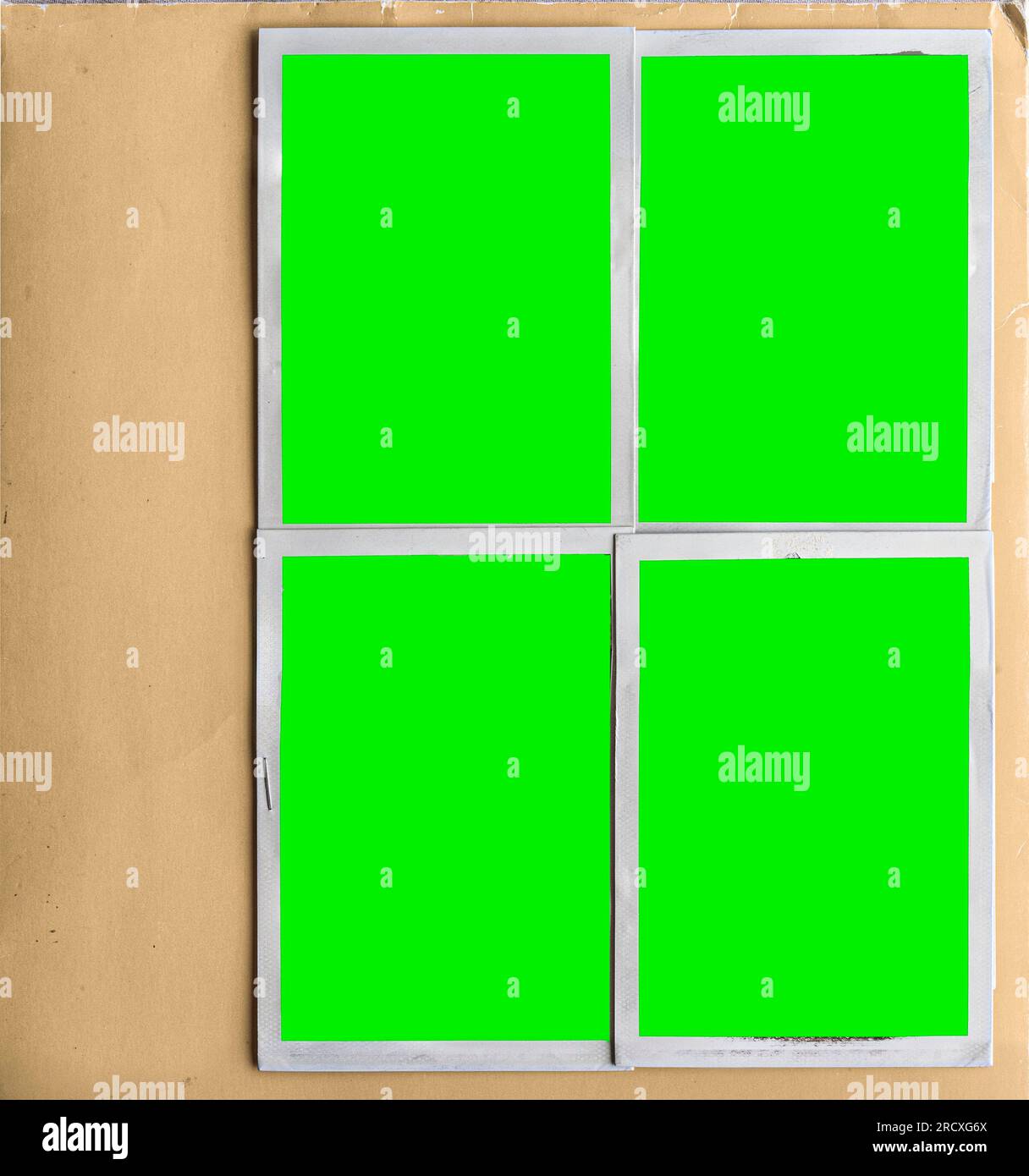 A vintage book page with four blank photo frames stock photo alamy