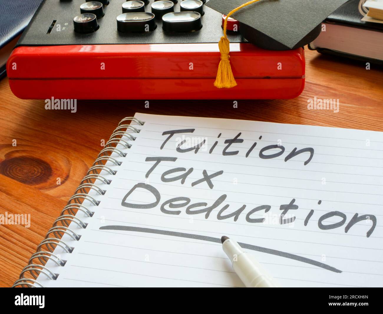 Tuition tax deduction mark in the notebook Stock Photo - Alamy