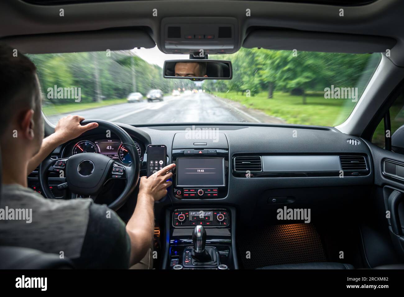 Hands on the wheel when driving from inside the car Stock Photo Alamy