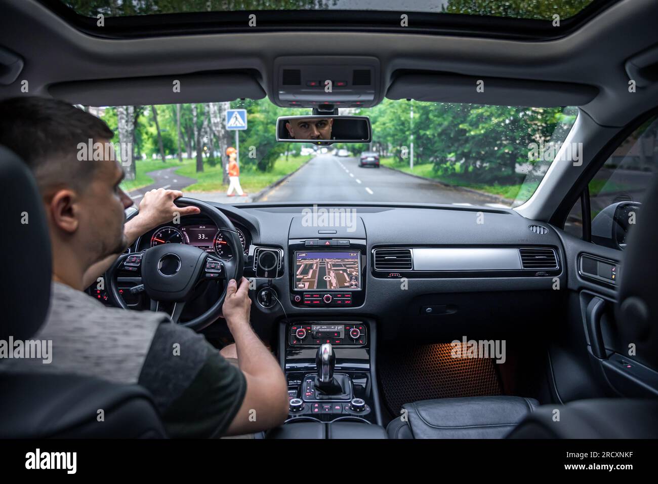 Hands on the wheel when driving from inside the car Stock Photo Alamy
