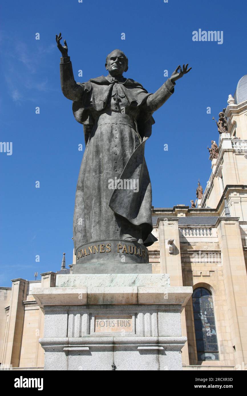 MADRID, SPAIN - SEPTEMBER 2, 2009: Pope John Paul II sculpture in front of Almudena Cathedral, Madrid. Statue was designed by Spanish artist Juan de A Stock Photo