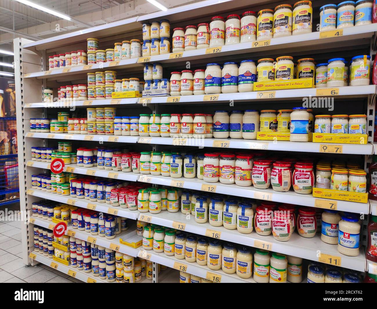 KATOWICE, POLAND - JANUARY 13, 2023: Various types and brands of mayonnaise in a supermarket in Katowice, Poland. Stock Photo