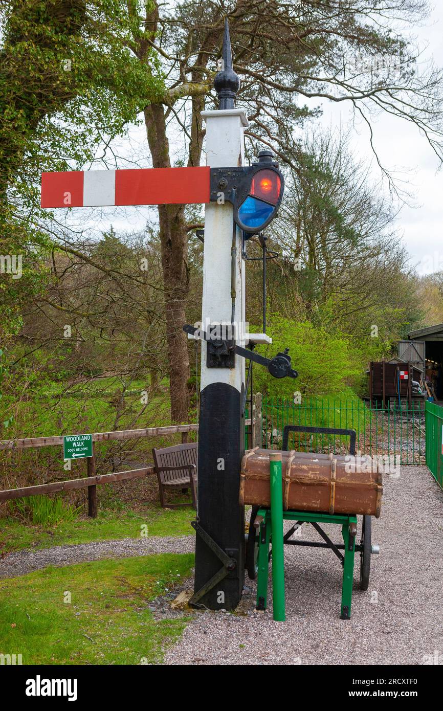 A traditional British railways semaphore home signal, with porter's