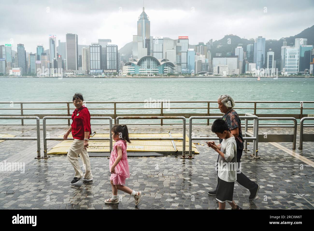 Hong Kong. 17th July, 2023. People walk at Tsim Sha Tsui during the No.8  Warning signal. In the early hours of July 17th, as Typhoon Talim  approaches Hong Kong, the Hong Kong