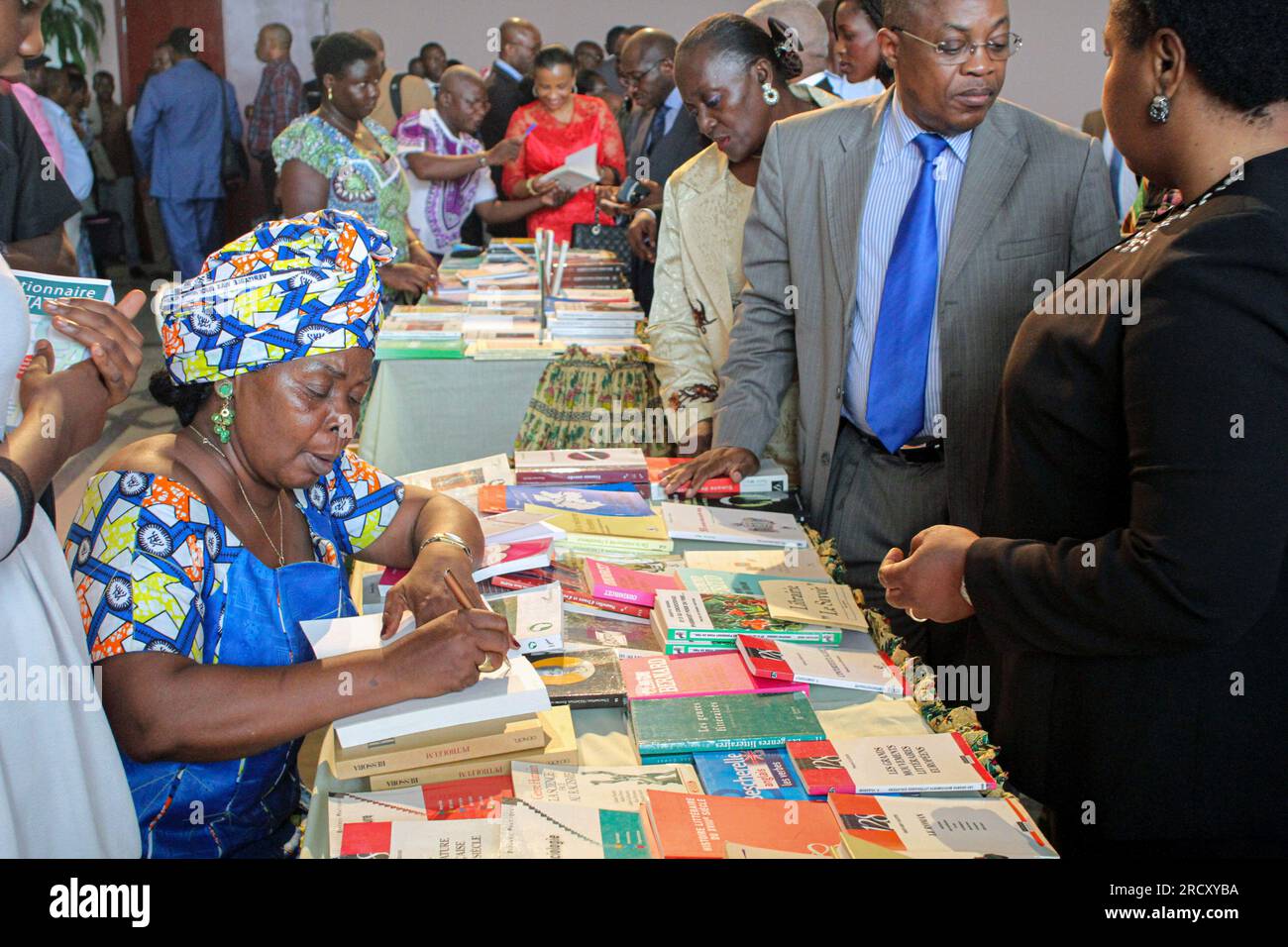 Book dedication session by their authors during the celebration of the International Day of the African Writer at the Maison Georges Rawiri in Libreville, on 07 November 2016 Stock Photo