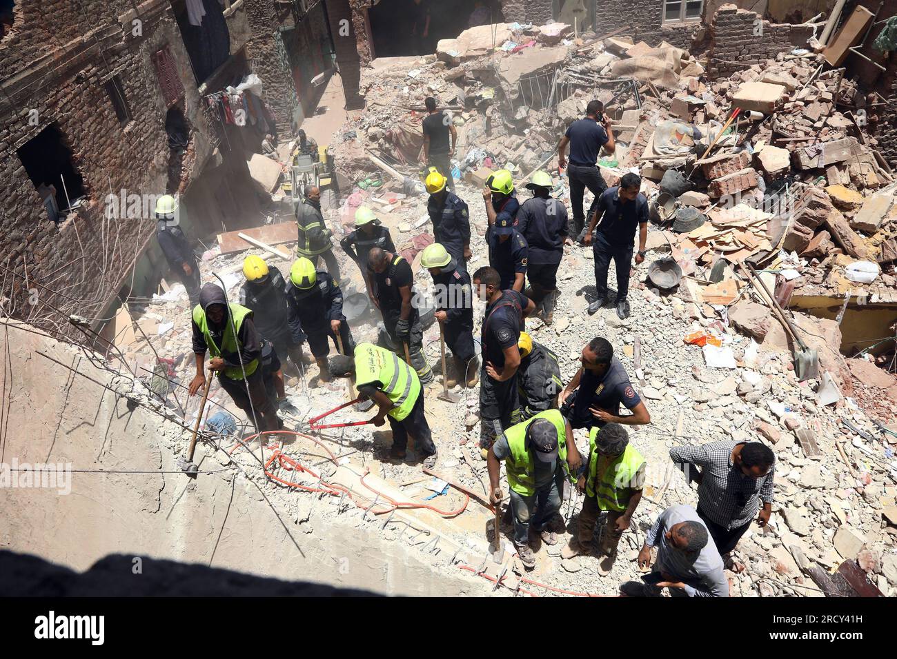 Cairo, Egypt. 17th July, 2023. Rescuers work at a building collapse ...