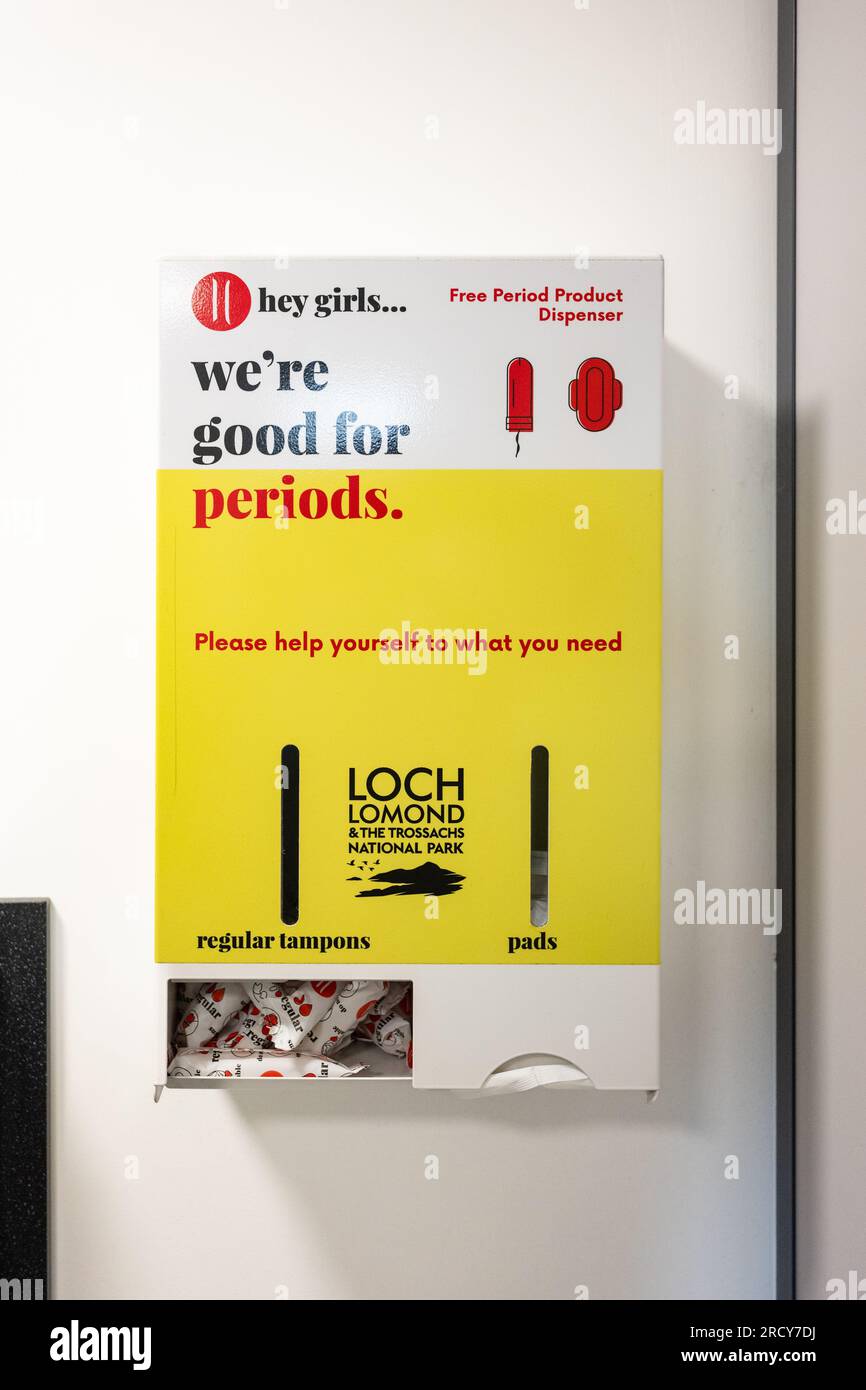 Hey girls Free period products dispenser inside ladies toilets, Loch Lomond and the Trossachs National Park visitor centre, Balmaha, Scotland, UK Stock Photo