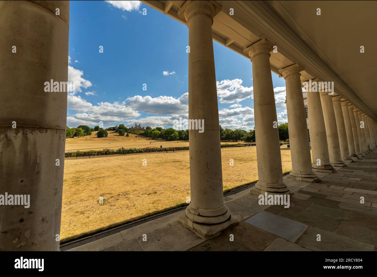 Greenwich cityscape. Greenwich park, view of the Royal Observatory through the colonnade. Visit for the Greenwich Meridian, the prime meridian line. Stock Photo