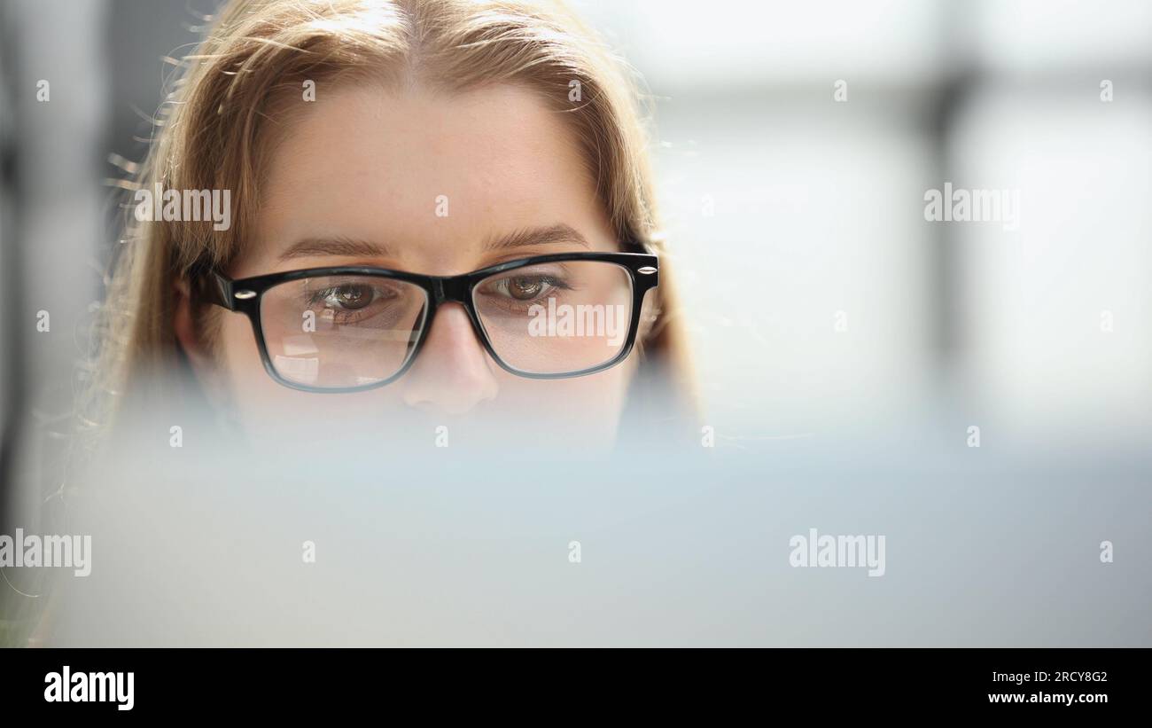 Female Scientist Manipulate and Program the Robot for Work Stock Photo