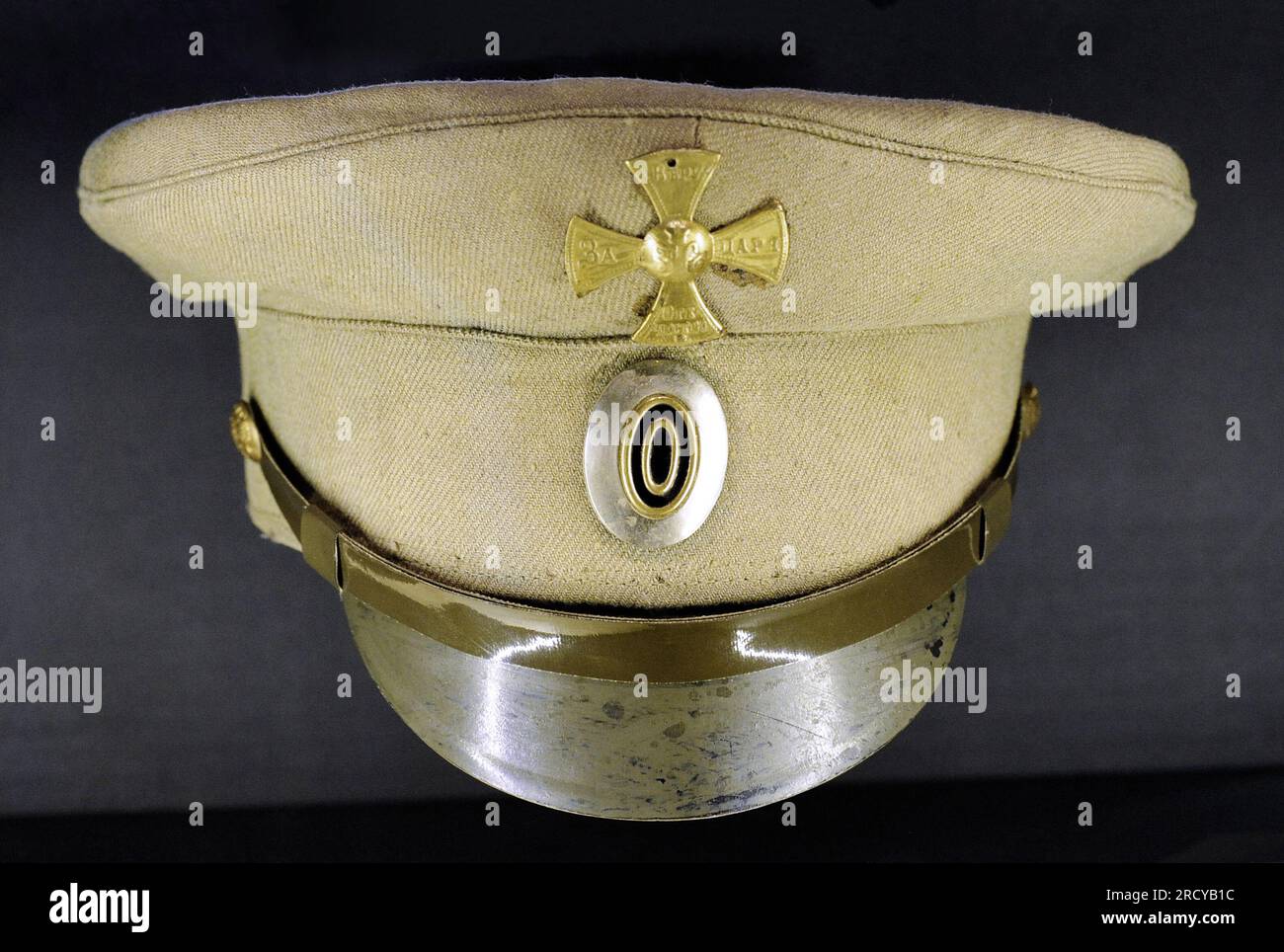 First World War (1914-1918). Russian army uniform cap with a home guard cockade. Men fit for service were conscripted into the Russian army at the beginning of the mobilisation in the summer of 1914. The conscripted home guards were organized into companies and battalions separately from other units. Before receiving full equipment and uniforms, they were endowed only with a rifle and a cap with Russian Army and home guard badges. Latvian War Museum. Riga. Latvia. Stock Photo