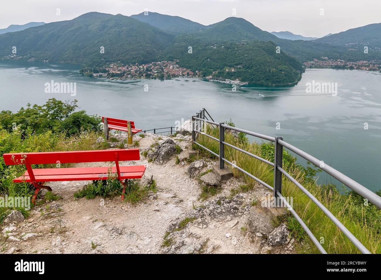 Two red wooden benches in the Sasso delle Parole viewpoint, Lugano, Switzerland Stock Photo