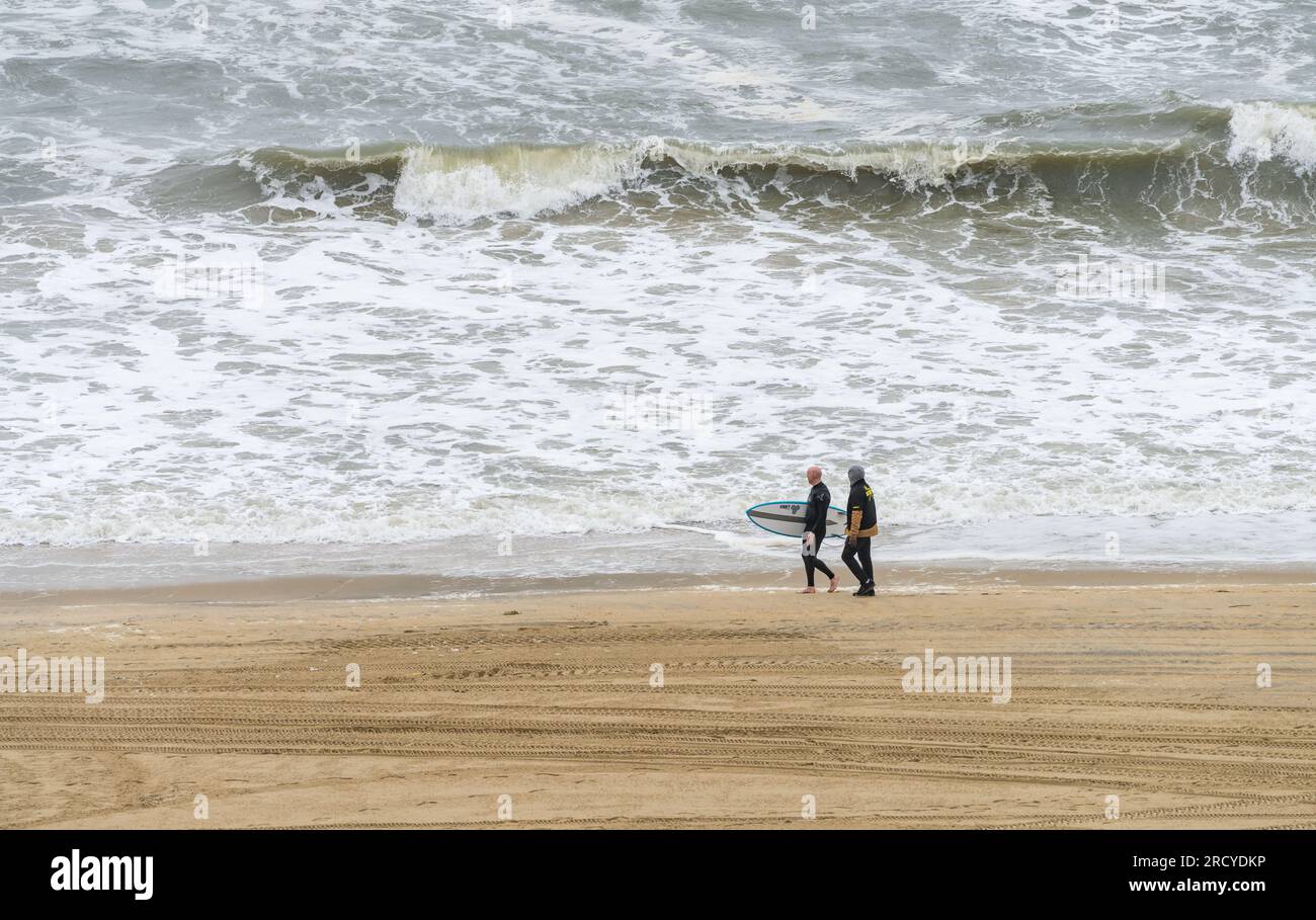 Virginia Beach, VA 21 June 2023 A surfer and security guard by rough