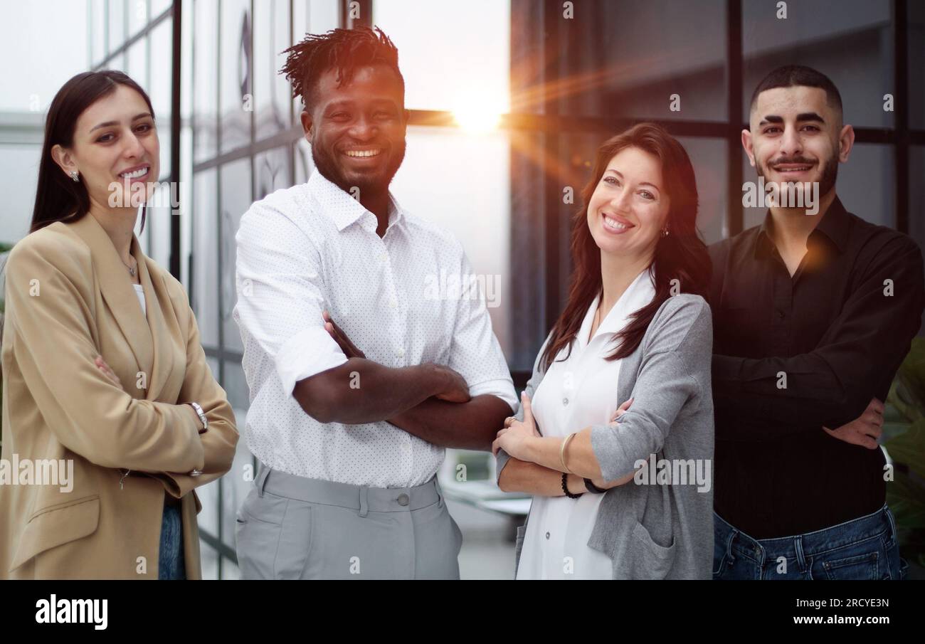 Happy multiethnic professional business team standing together in ...