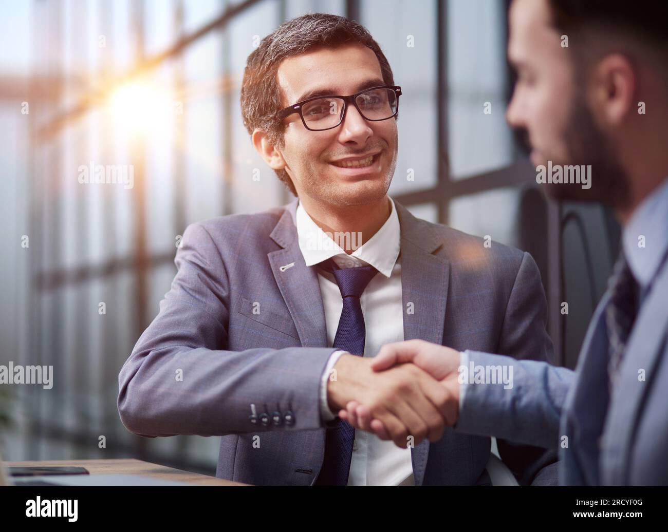 Two diverse business men analysts partners talking, working together Stock Photo