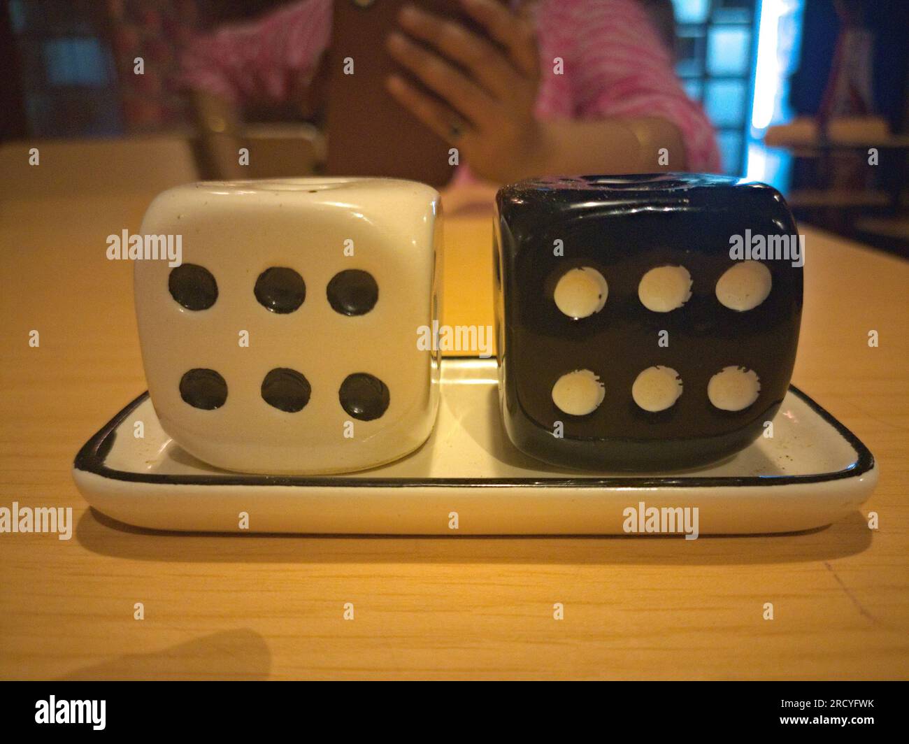 ludo dice shaped container in a restaurent Stock Photo Alamy