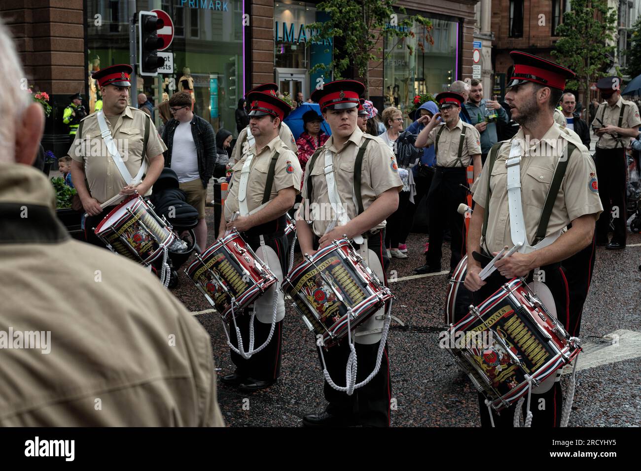 July 12, 2023, Belfast, Ireland: Members of the East Belfast Blues and Royals flute band take a break from their march through Belfast City centre as part of the annual July 12th parade season. July marks the annual loyalist marching season as practiced by the Protestant unionist communities of Northern Ireland in commemoration of a centuries-old military victory of Protestant King William of Orange over Catholic King James the second. The season culminates with a day of parades throughout the North on the 12th of July following the Eleventh Night bonfire celebrations the previous night. (Cred Stock Photo