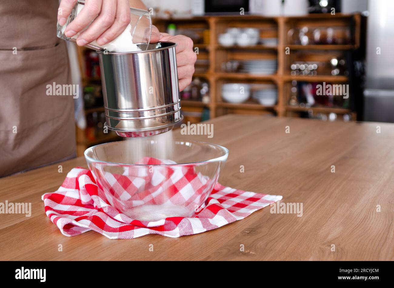 Sifting flour through sieve metal hires stock photography and images