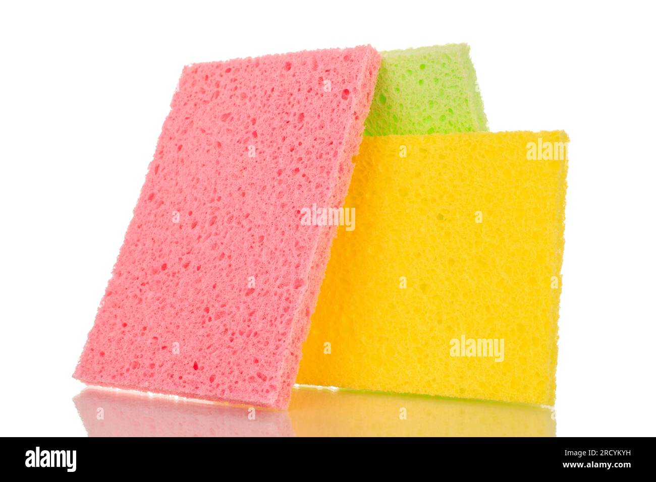 Three colored cellulose kitchen sponges, macro, isolated on white ...