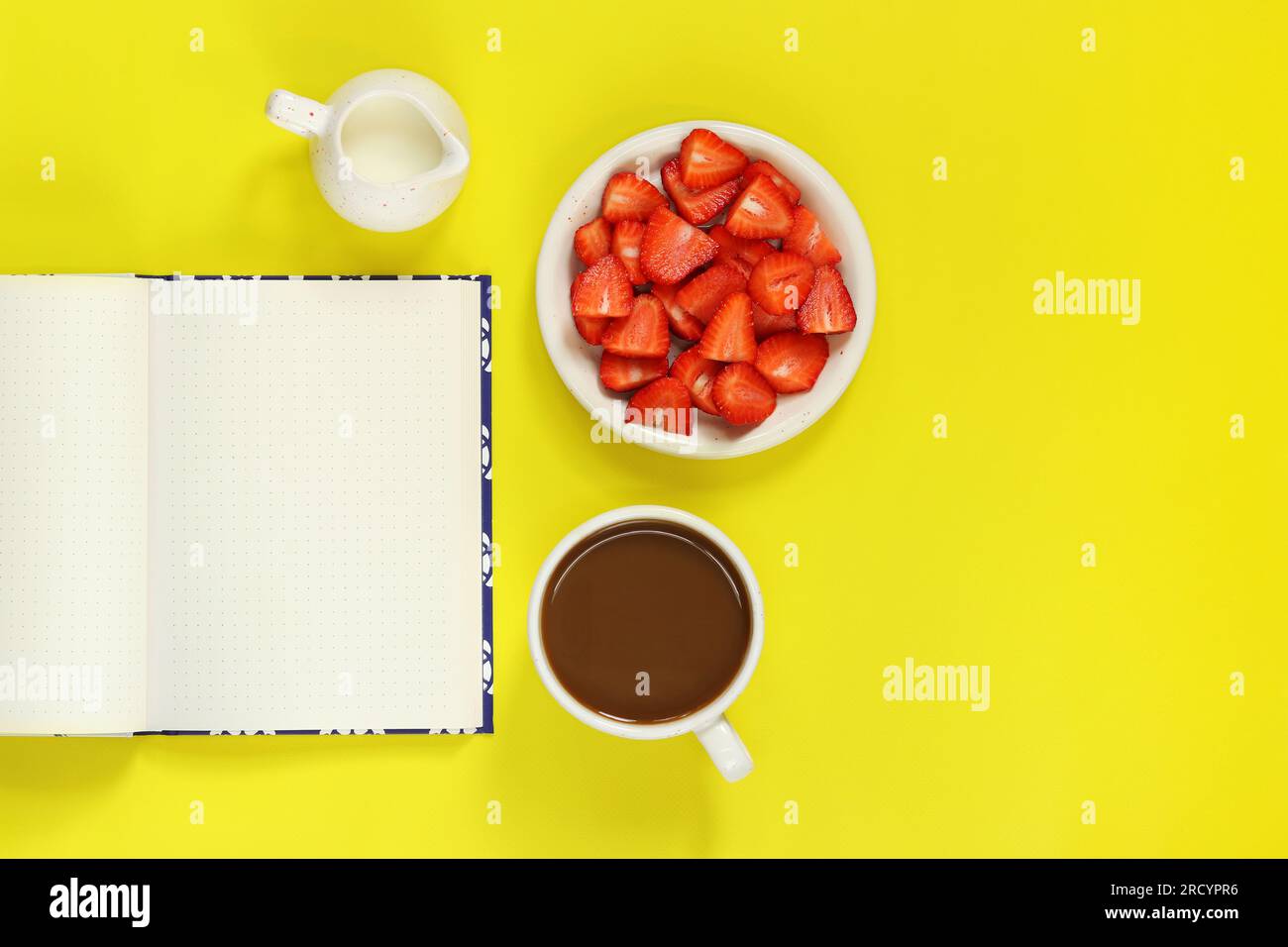 Cozy workspace. Mockup of an open notepad. Top view of a work desk, a