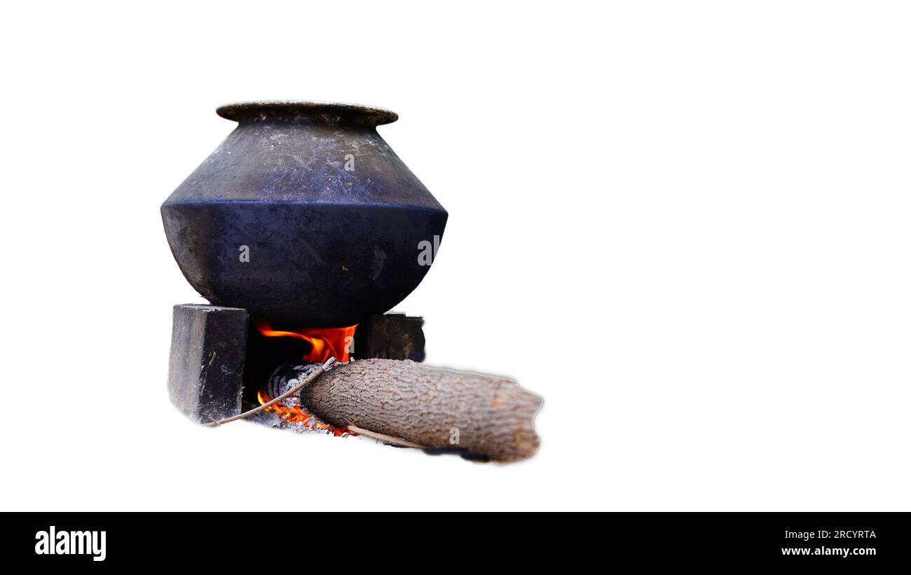 Traditional stoves used by residents in rural India, made of clay, fueled with wood on white background. Stock Photo