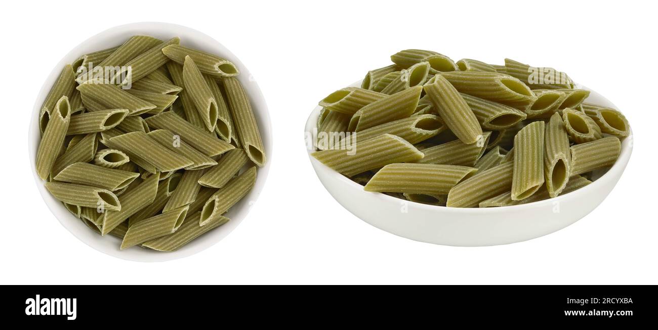 Green pea penne pasta in ceramic bowl isolated on white background. Organic food speciality. Gluten free. Top view. Flat lay Stock Photo