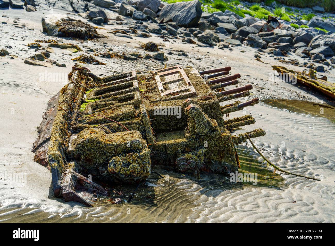 Remains of a sunken ship. wrecked cargo ship in Norway fjord. The ...