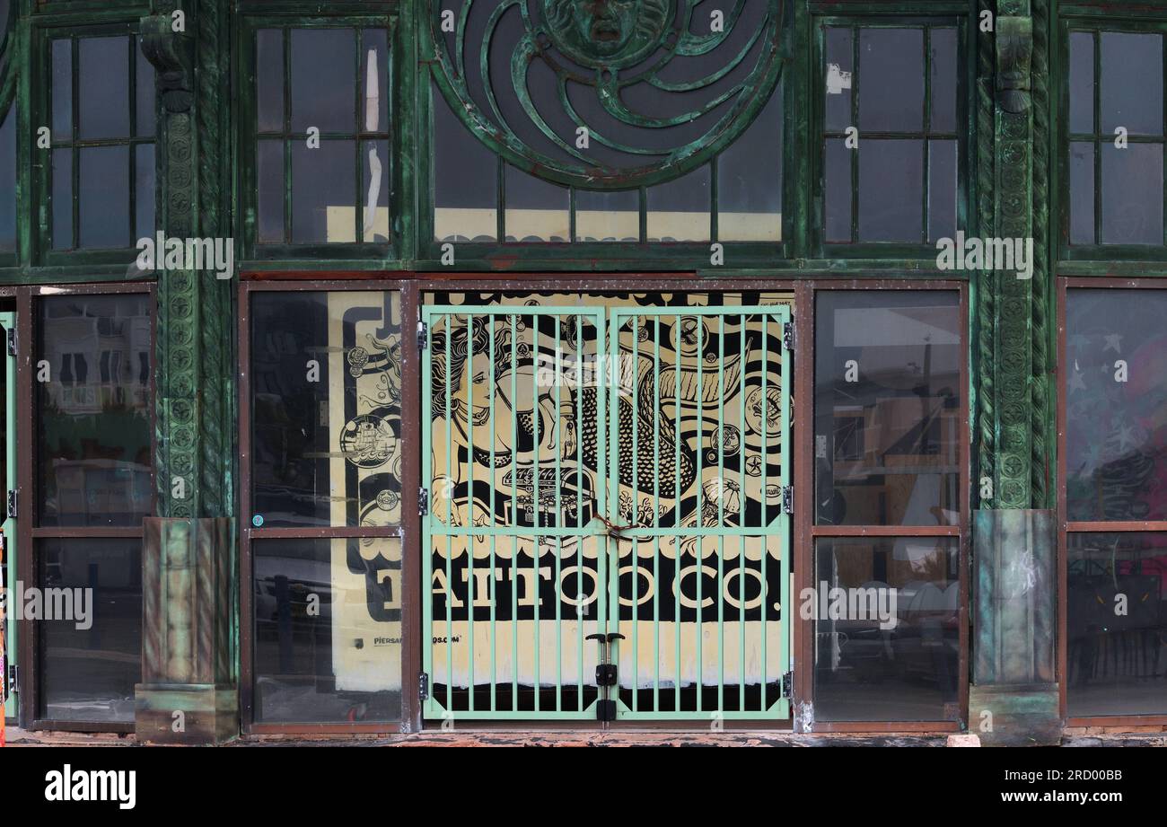 The closed gates of a building in ruins. Stock Photo