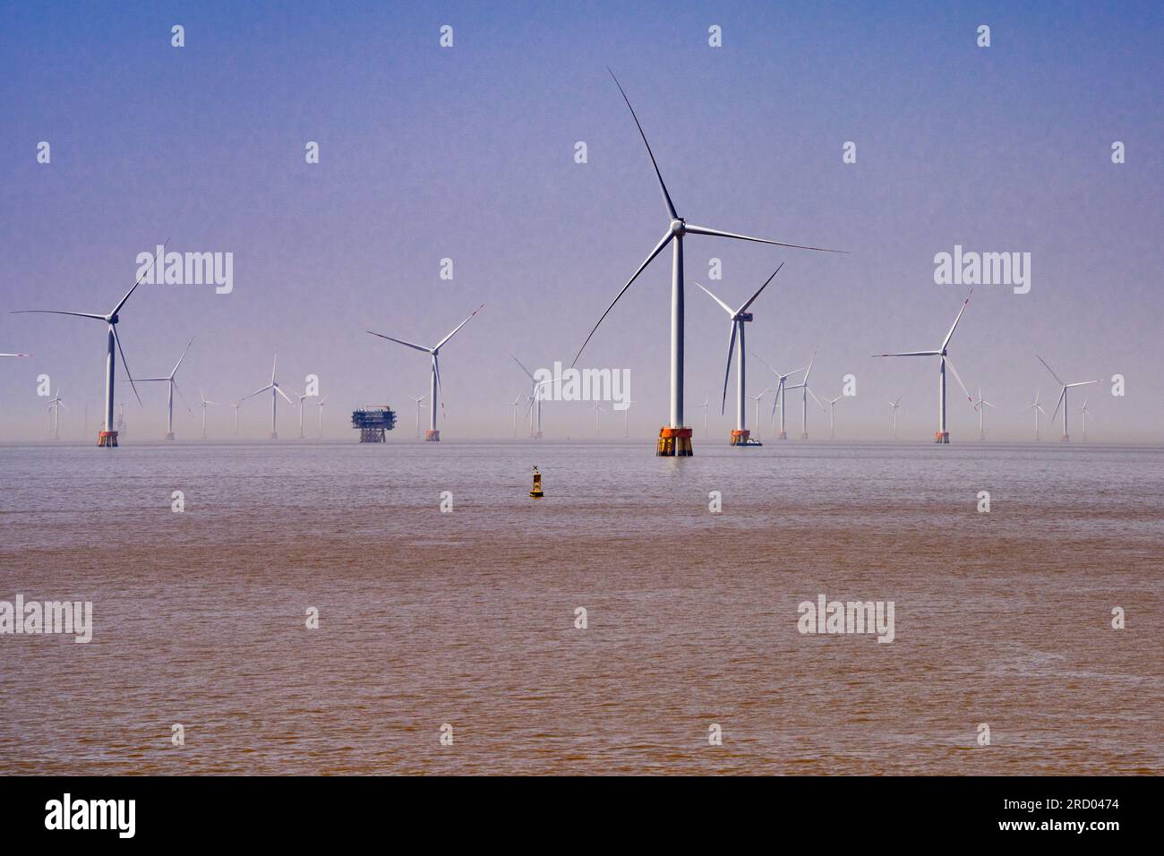 Wind turbines in the East Sea near Shanghai’s Yangshan Port which is technically in Zhoushan, Zhejiang Province, China. Stock Photo