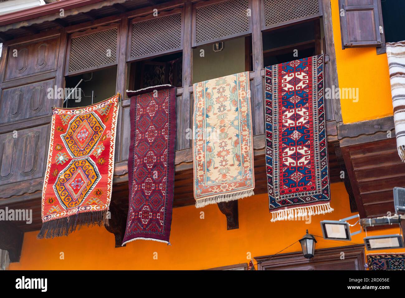 Old typical house in oriental style with carpets on the balcony in
