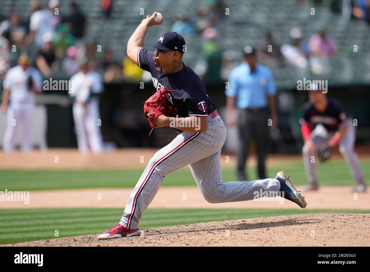 Minnesota Twins pitcher Jhoan Duran (59) delivers a pitch in the eighth  inning during a spring training baseball game against the Tampa Bay Rays at  the Charlotte Sports Park Tuesday March 29