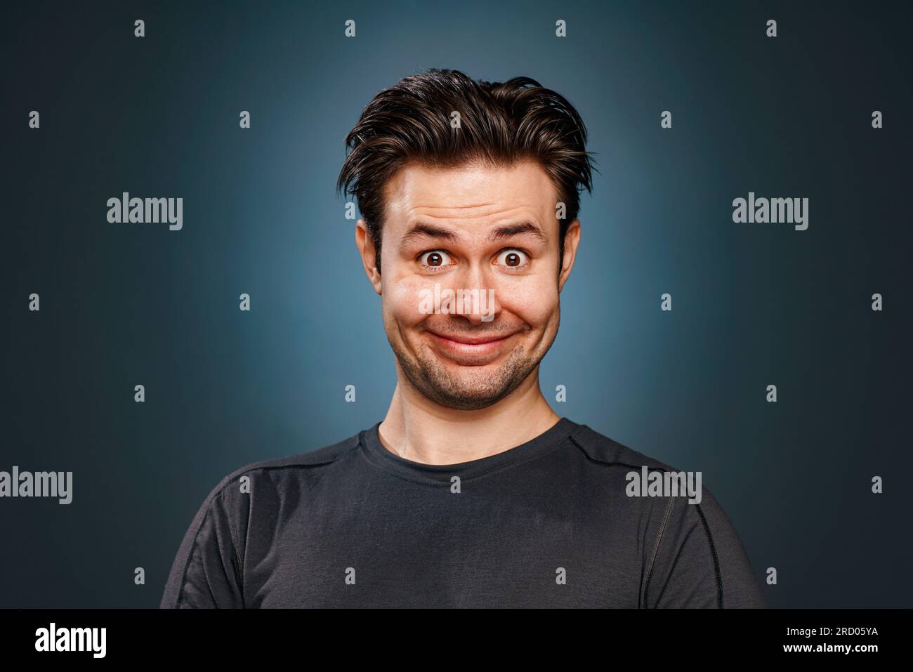 Young man silly smiling portrait Stock Photo