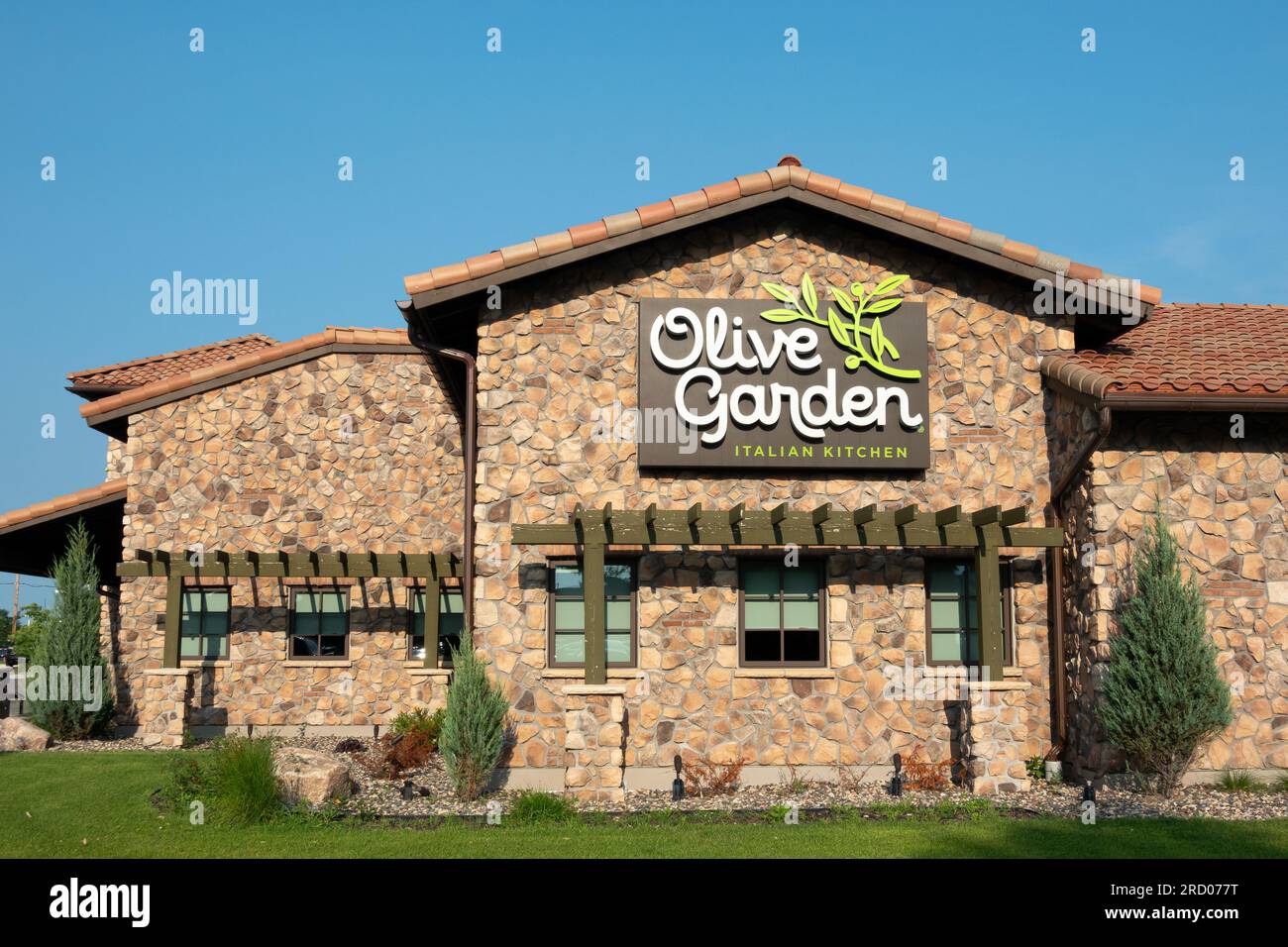 BLOOMINGTON, MN, USA - JULY 13, 2023: Olive Garden restaurant exterior sign and trademark logo. Stock Photo