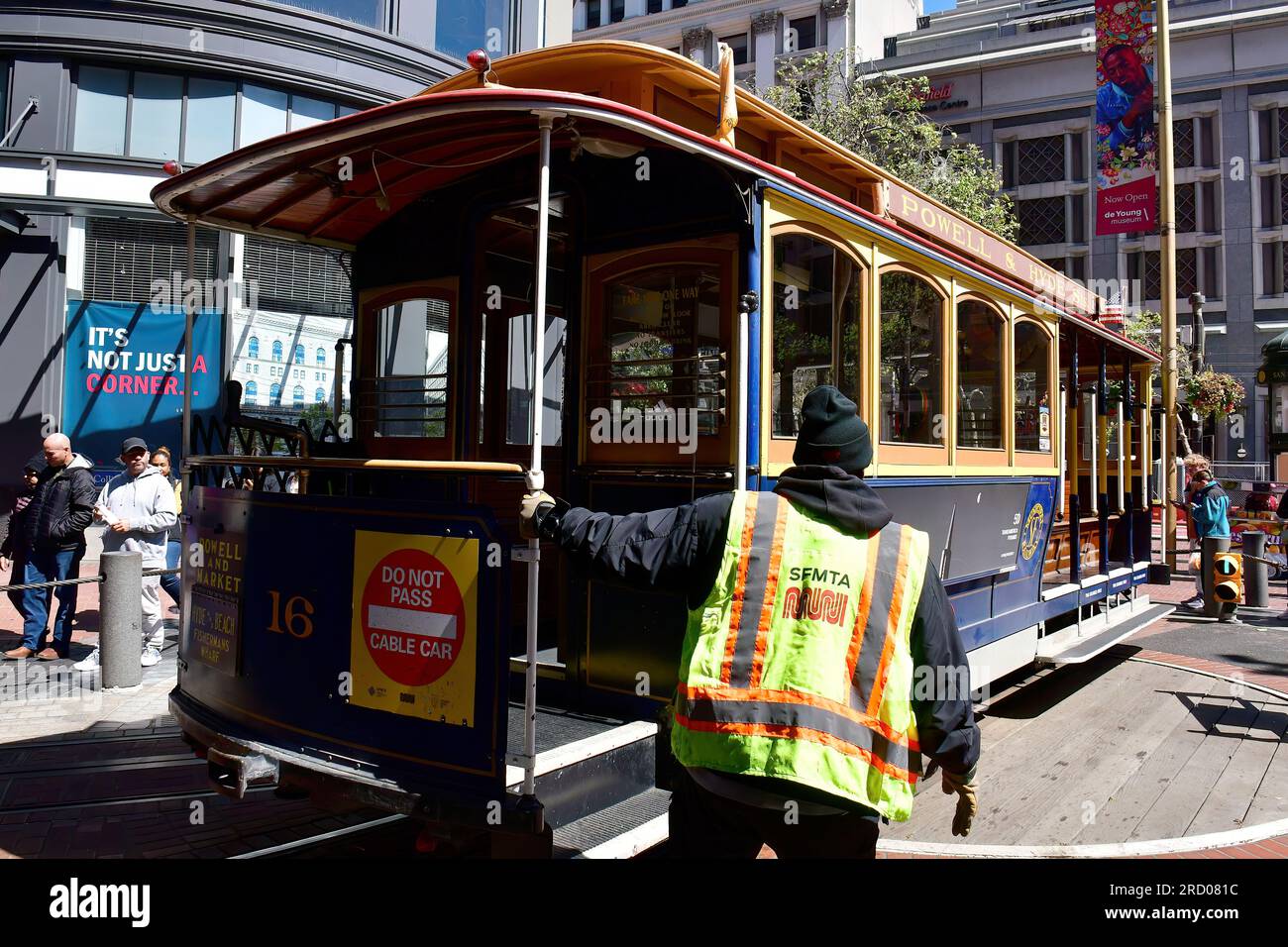Drivers turning cable car on a turntable, San Francisco, California