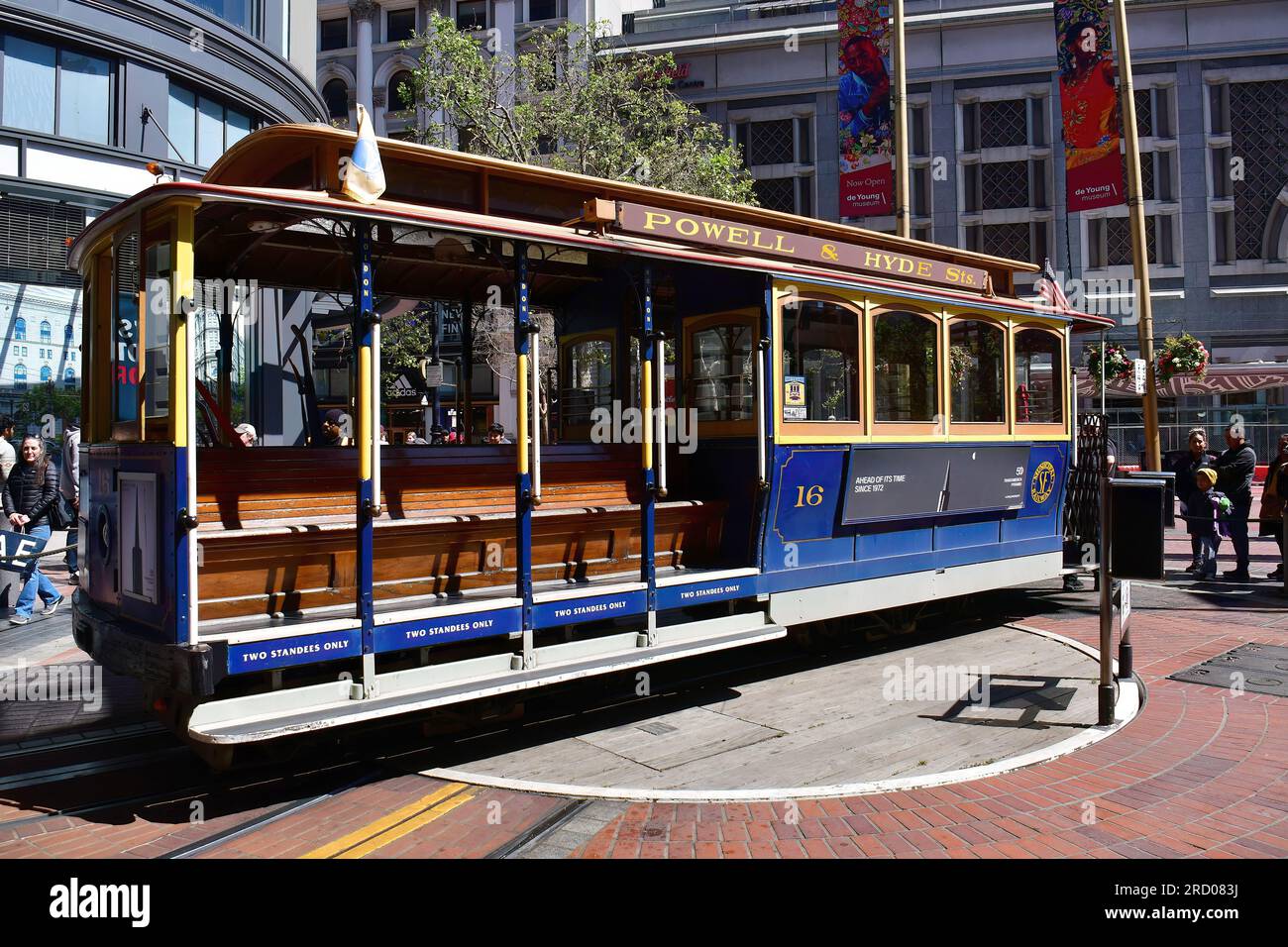 Drivers turning cable car on a turntable, San Francisco, California