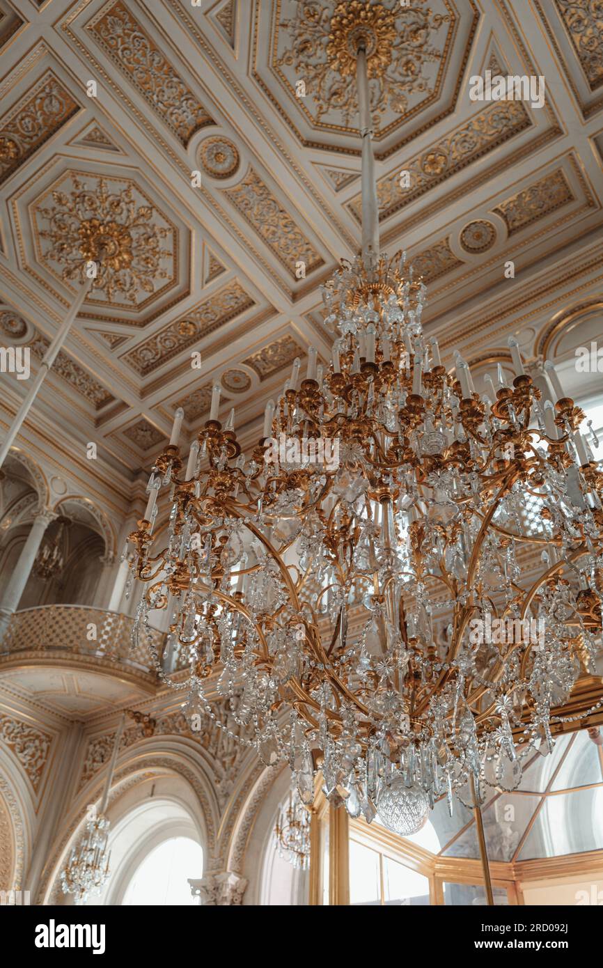 Historical golden white the State Hermitage Museum interiors with crystal chandelier. Famous historical place. Baroque architecture Stock Photo
