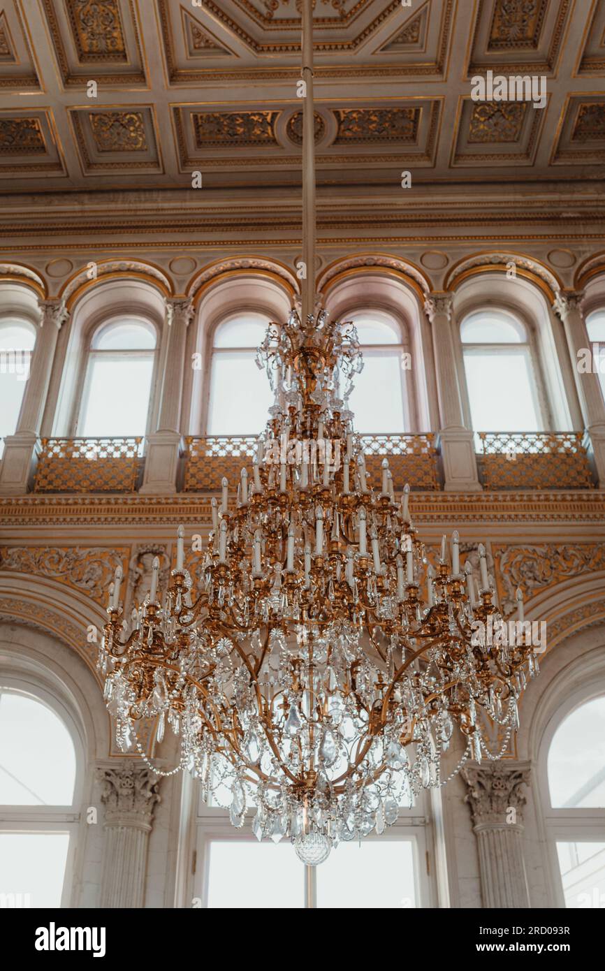Historical golden white the State Hermitage Museum interiors with crystal chandelier. Famous historical place. Baroque architecture Stock Photo