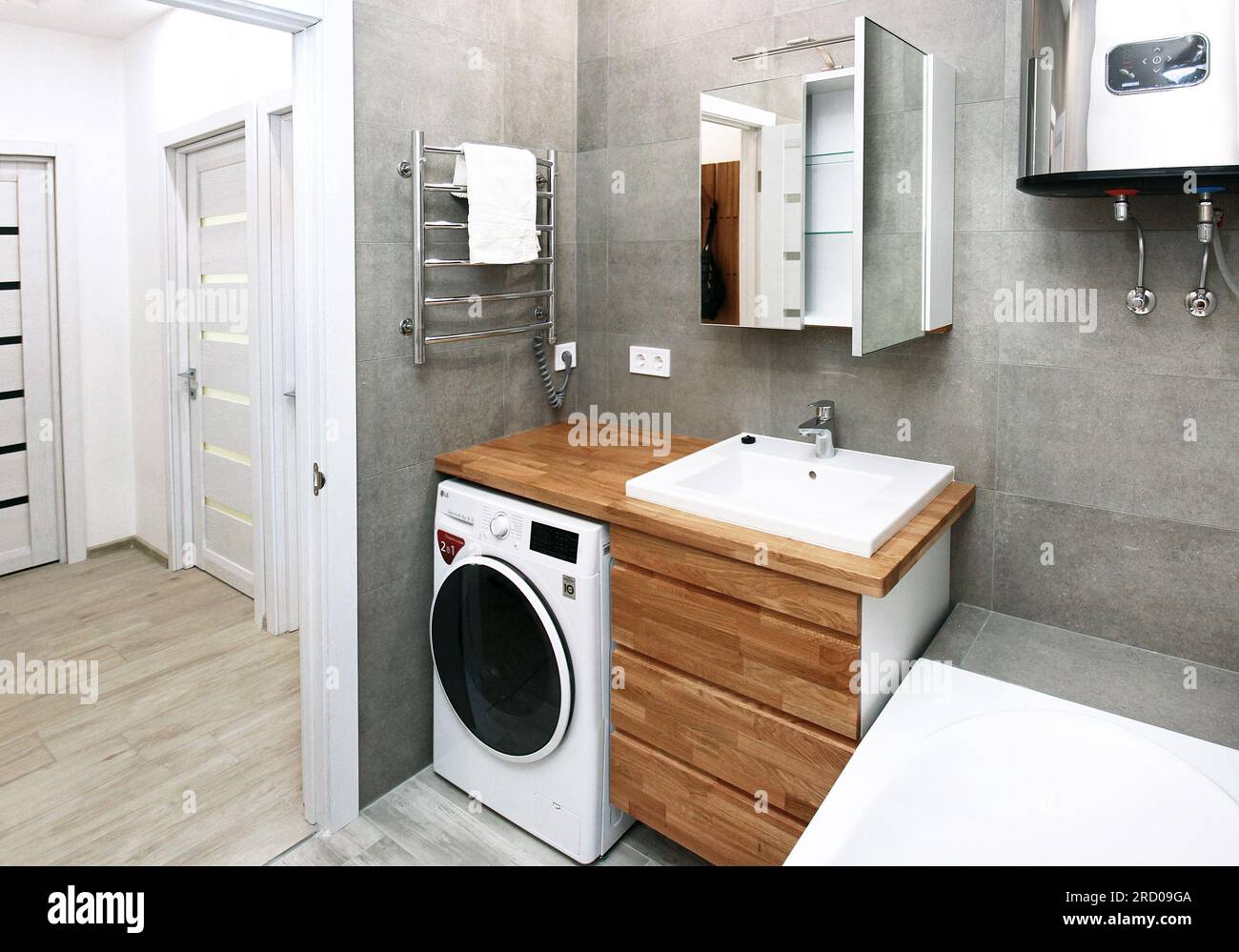 ecofriendly bathroom with a mirror, wooden bedside table under the