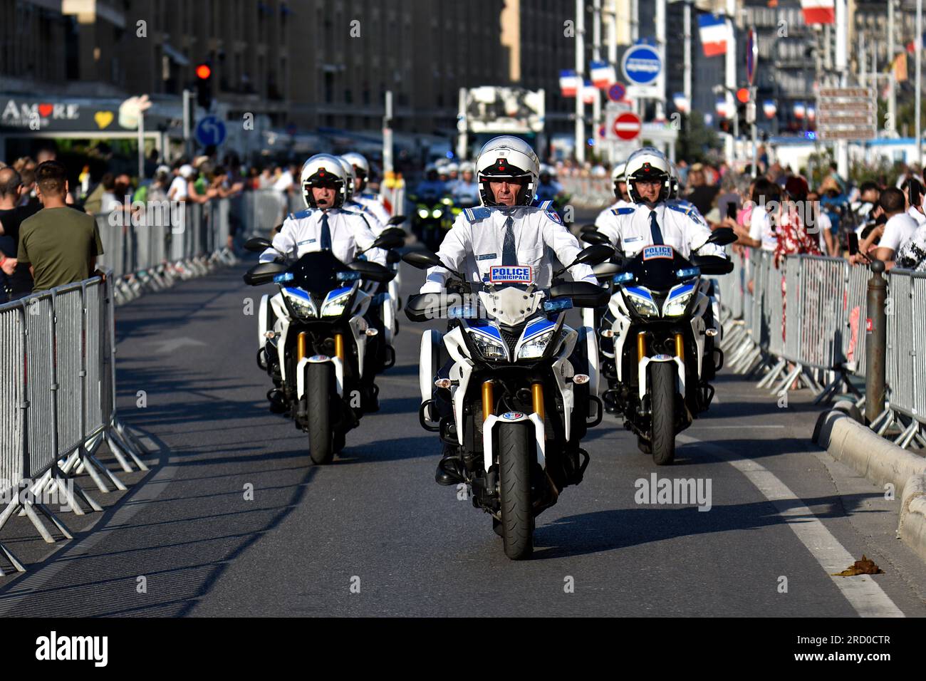 Marseille, France. 14th July, 2023. Officers of the Municipal Police of  Marseille on their motorbikes parade at the Old Port of Marseille during  the National Day military parade. Motorized military parade on