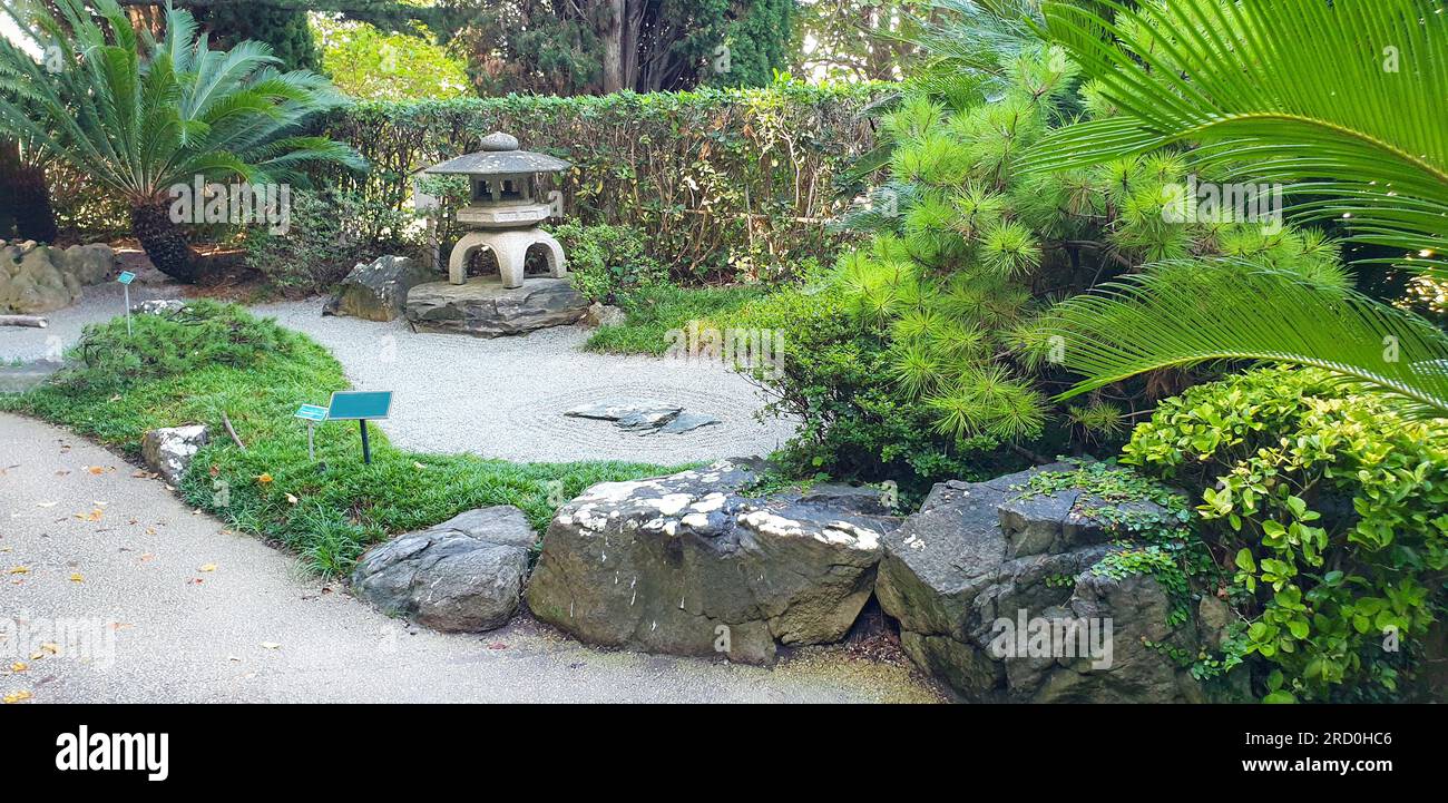 Japanese garden of Villa and gardens Ephrussi de Rothschild  in Saint-Jean-Cap-Ferrat:  Rock Japanese garden witth sand and stones,  palm trees and su Stock Photo