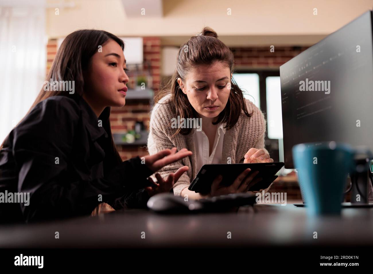 Diverse programming engineers analyzing html code on computer, planning artificial intelligence project. Web developers working on machine learning software, developing new interface. Stock Photo