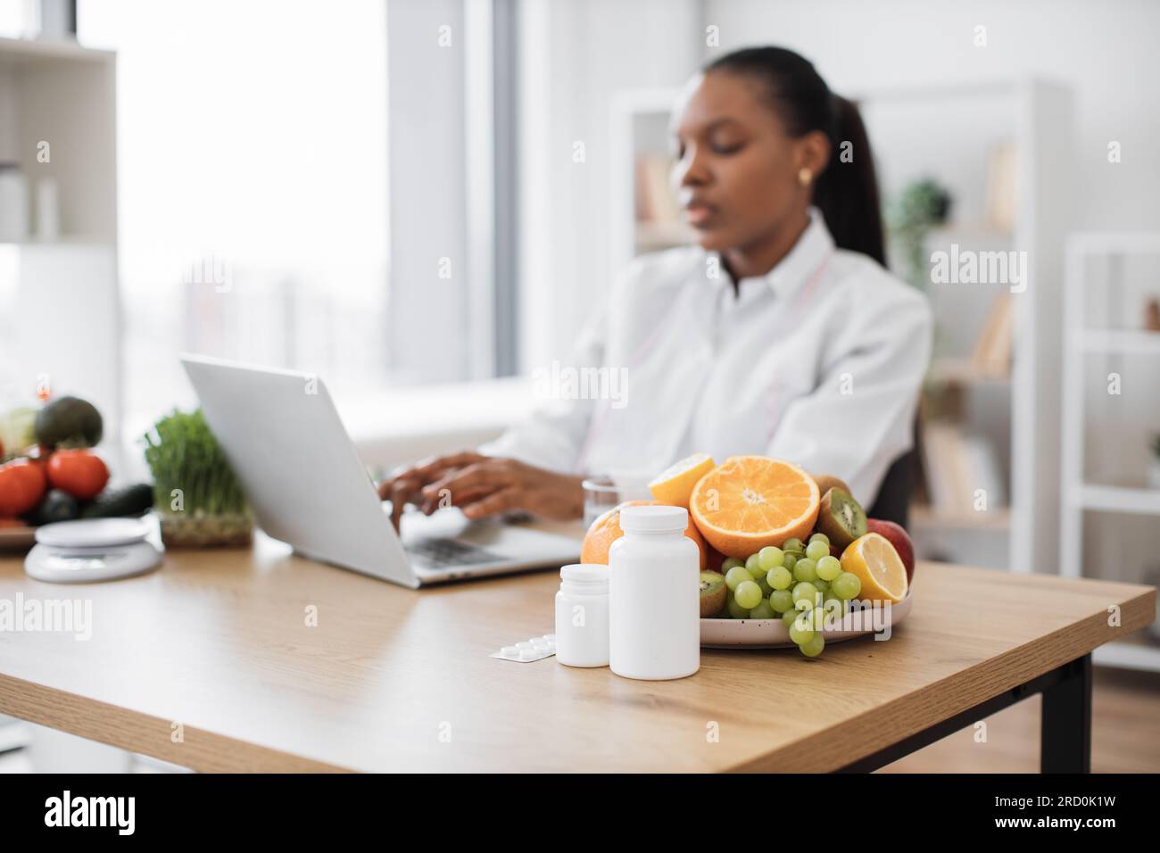 Help Desk Food Selective focus of fresh fruits and medications being placed on writing ...