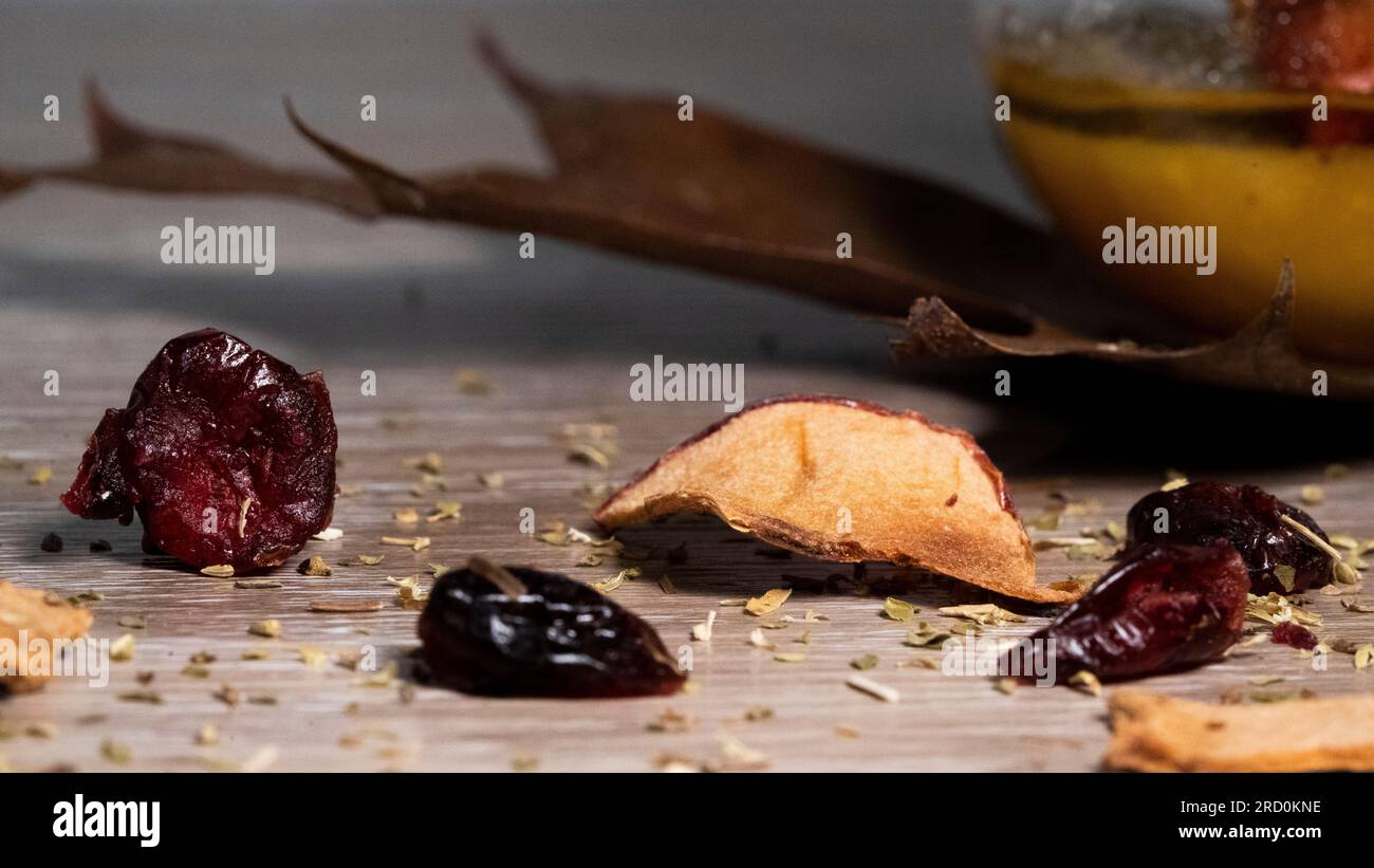 Dried cranberry with wooden and leaf setting Stock Photo