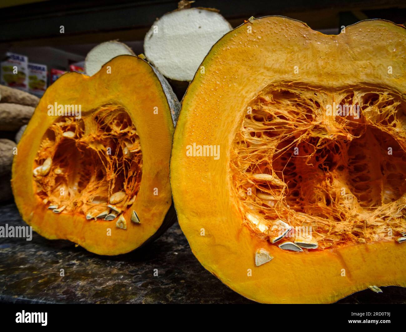 Food close up of pumpkin sliced for sale showing seeds Stock Photo