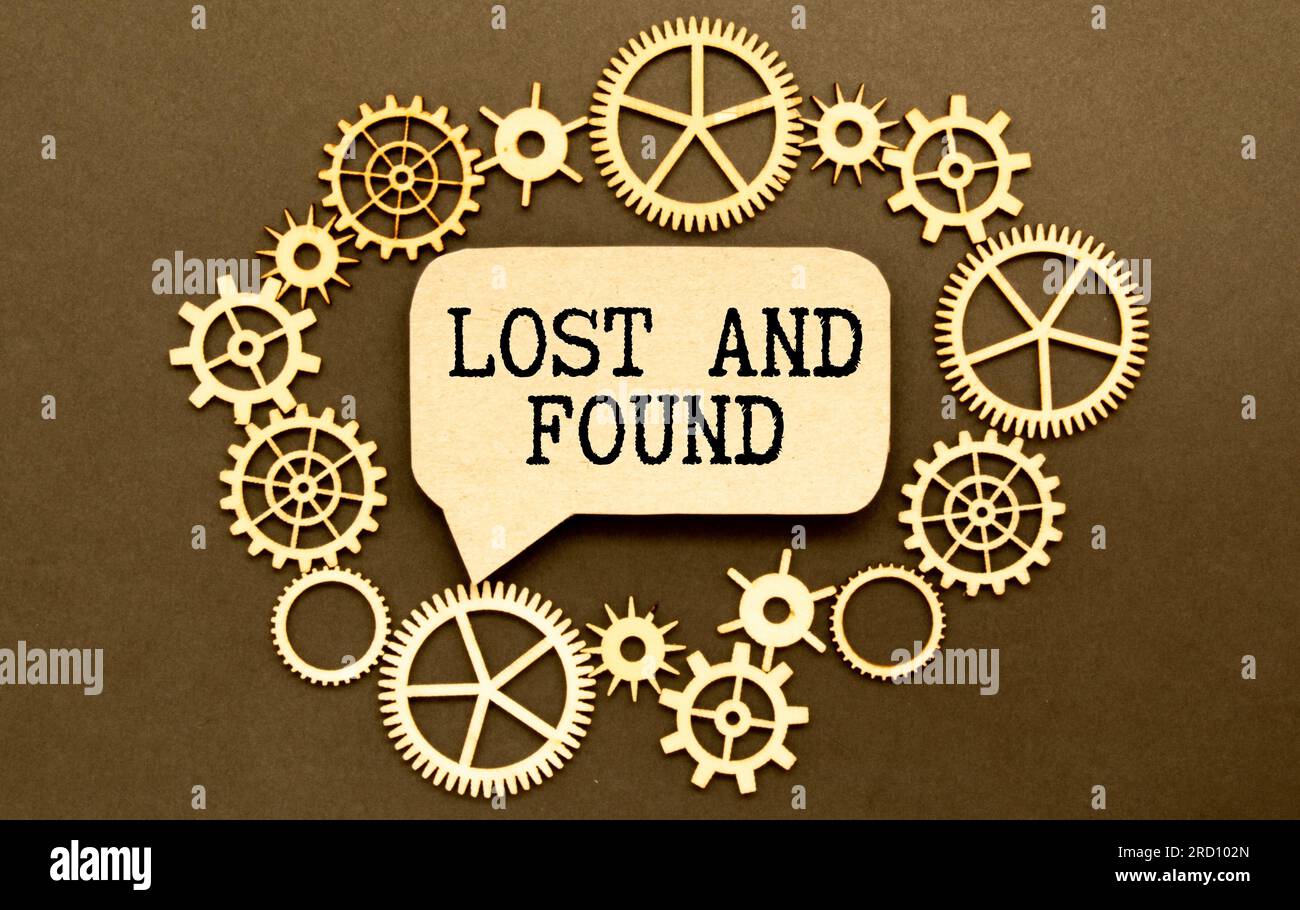 lost found text on an open notepad against the background of money and dollar bills Stock Photo
