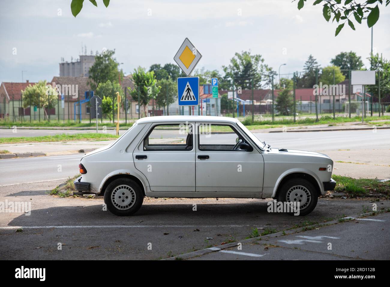 Picture of a Skala car, white colors, branded as Zastava 55 and Yugo 55, parked in a car park of Ruma Serbia. Skala is a generic name for a family of Stock Photo