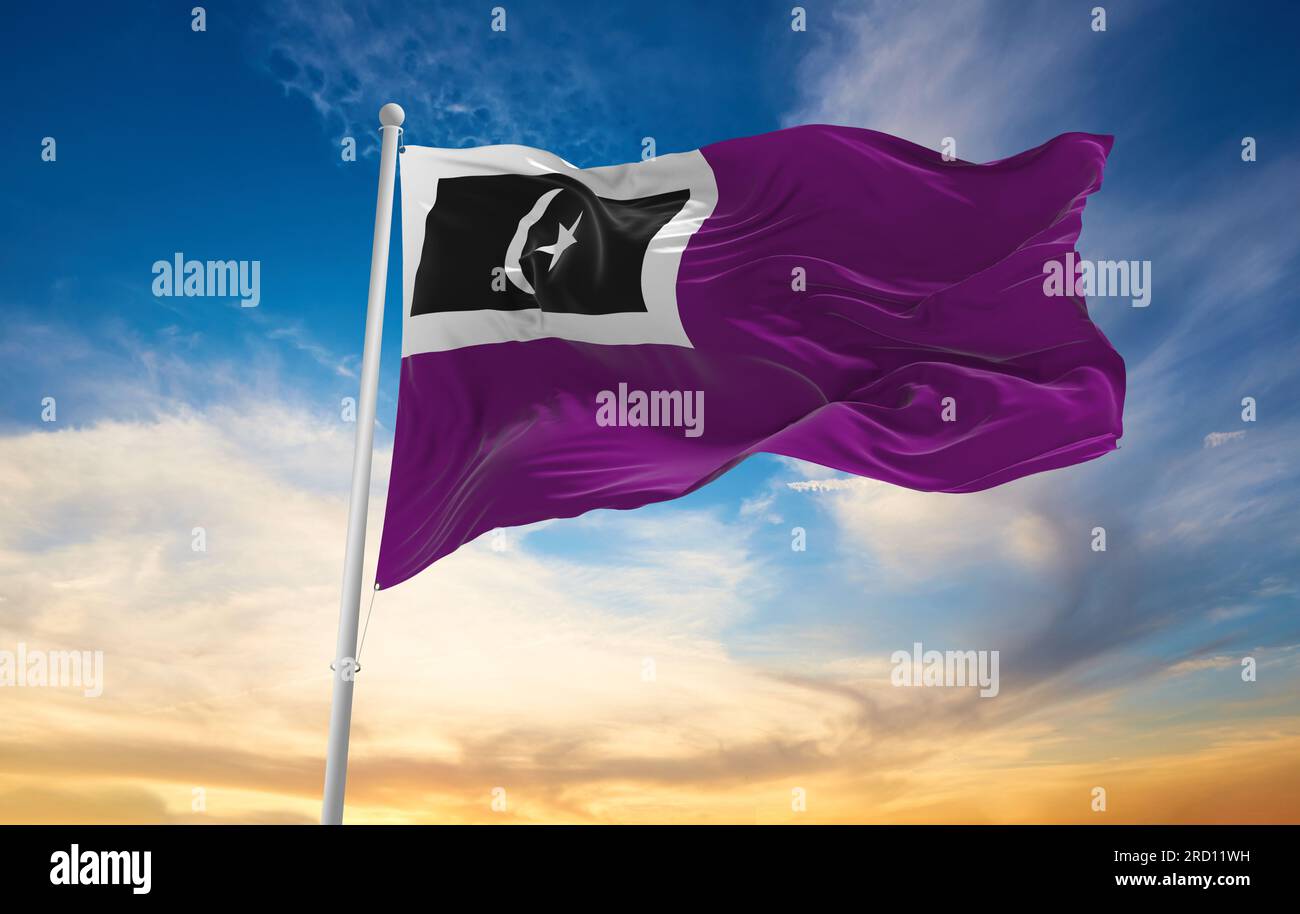 official flag of Marang, Terengganu Malaysia at cloudy sky background on sunset, panoramic view. Malaysian travel and patriot concept. copy space for Stock Photo