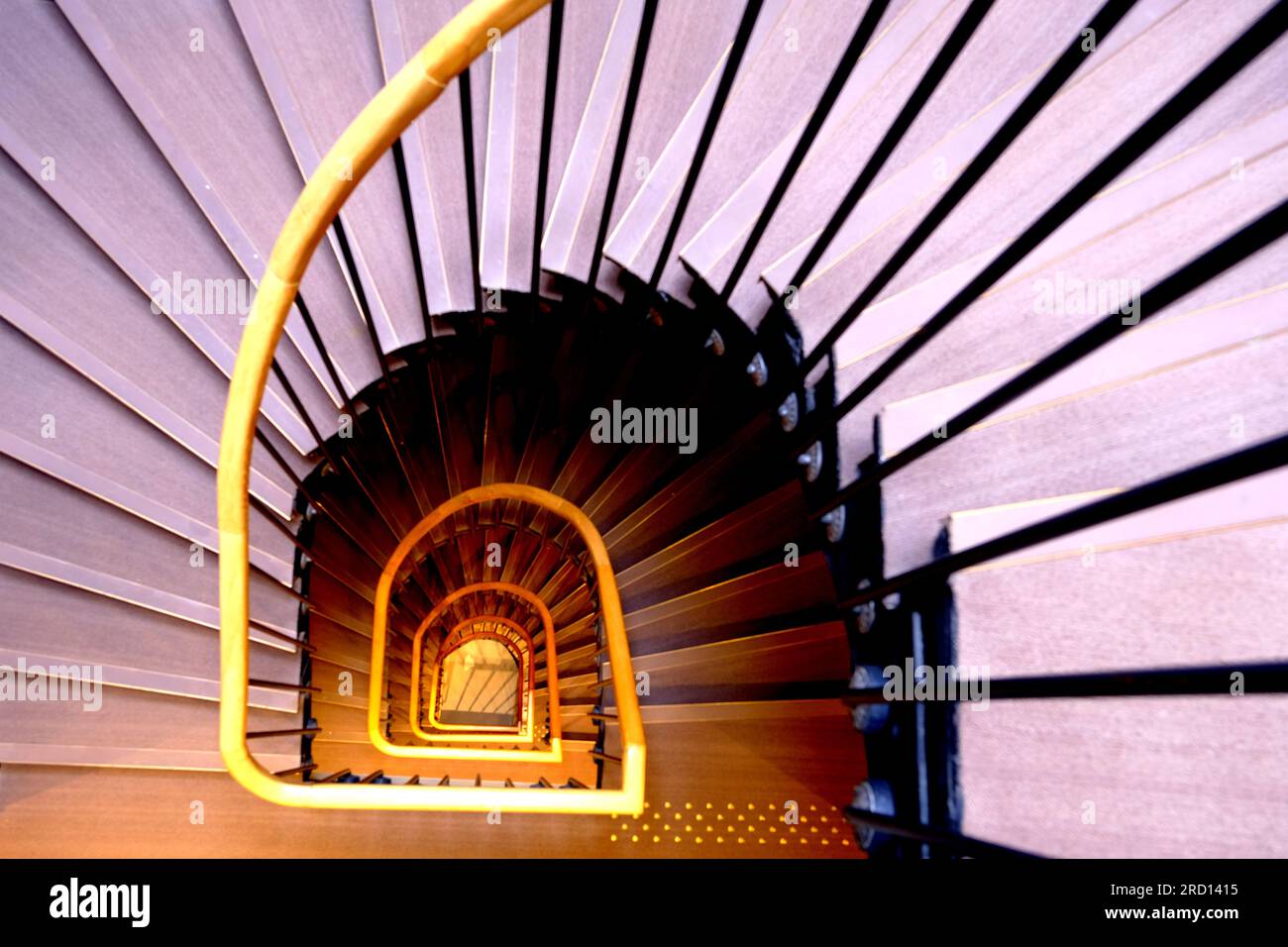 Looking down a spiral staircase Stock Photo