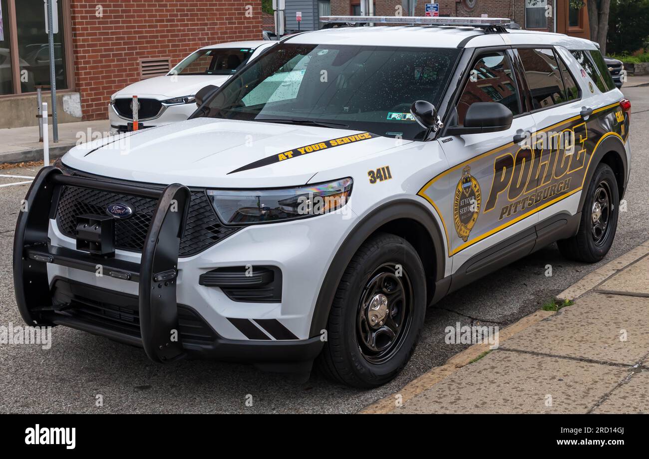 A Pittsburgh Police Department patrol SUV parked on a street in the